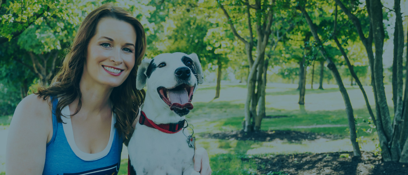 woman hugging a dog